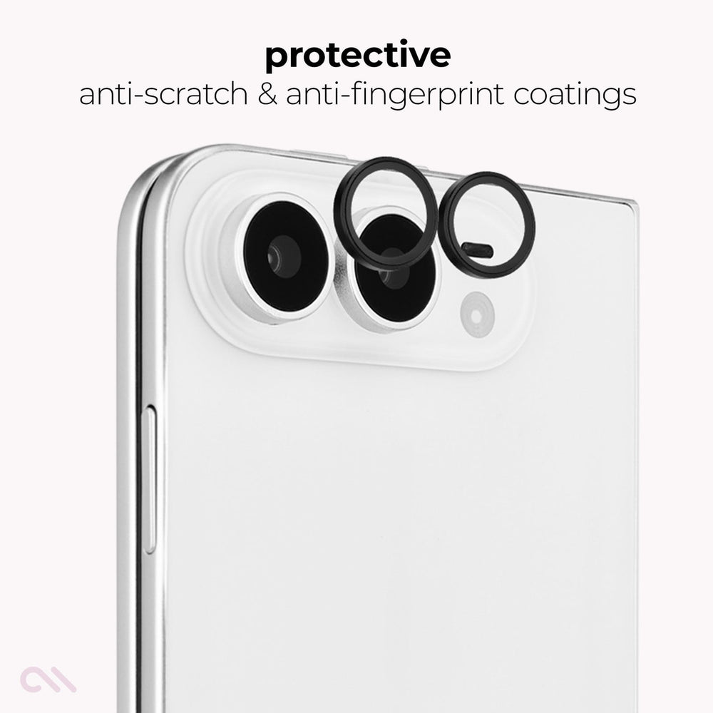 A close-up of the back of a white smartphone showing two circular black protective camera lens covers applied over the camera lenses, with text above reading 'protective anti-scratch & anti-fingerprint coatings'.