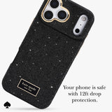 Kate Spade New York black glitter phone case with gold trim around the camera cutouts and a gold brand patch, shown on a light gray background with promotional text.
#color_crystal pavé