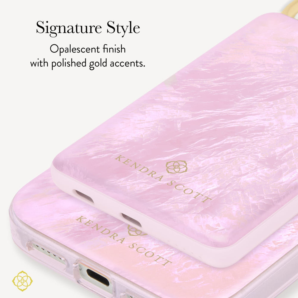A close-up of a Kendra Scott power bank with an iridescent finish and polished gold accents, shown on a white background with descriptive text calling out the opalescent finish with gold accents 
#color_pink pearl