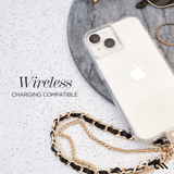 Clear iPhone 15 case with dual camera cutout and attached gold chain strap on marble surface.