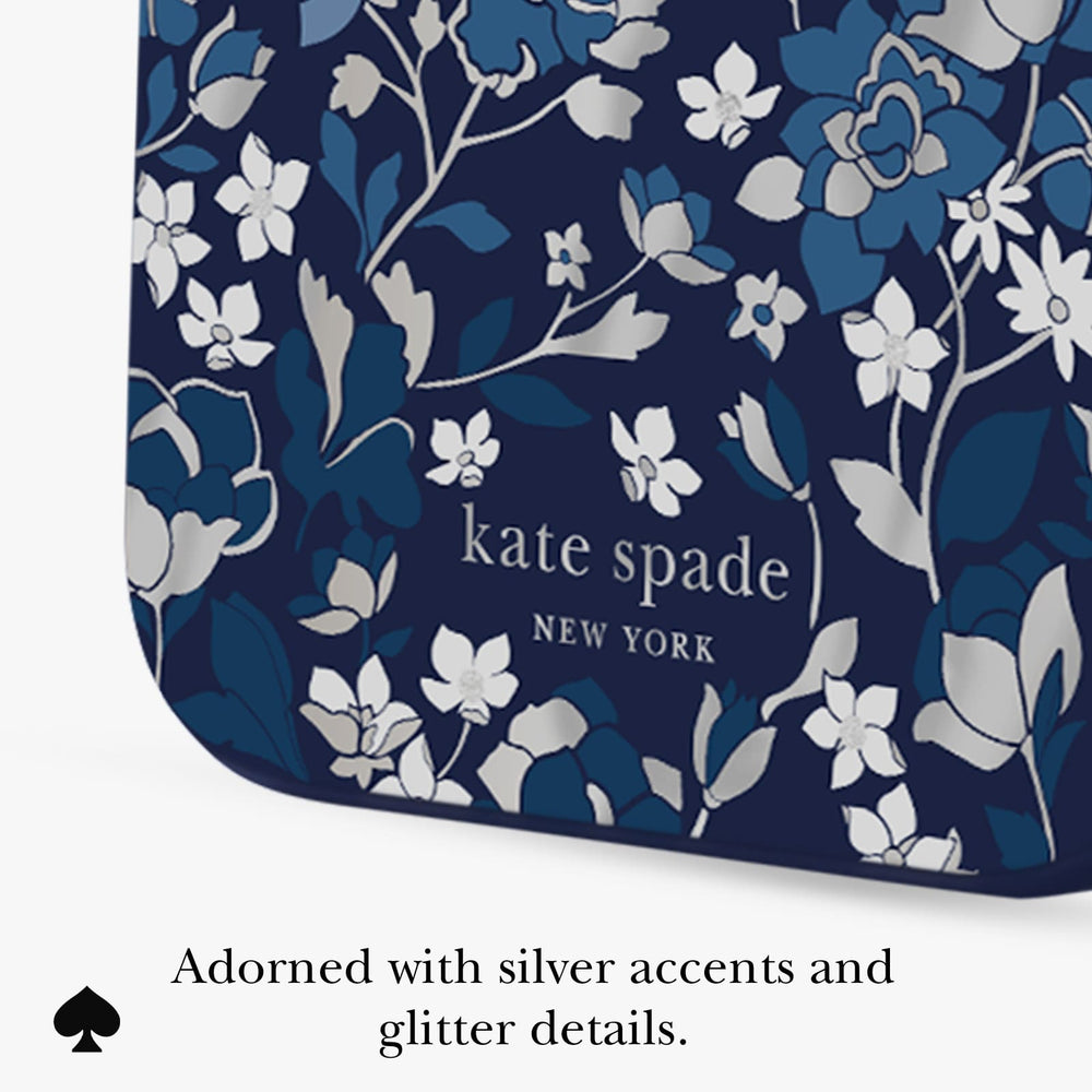 Kate Spade New York clutch or pouch in navy blue with a white and blue floral pattern and silver glitter accents, shown on a white background with descriptive text below.
#color_flowerbed navy
