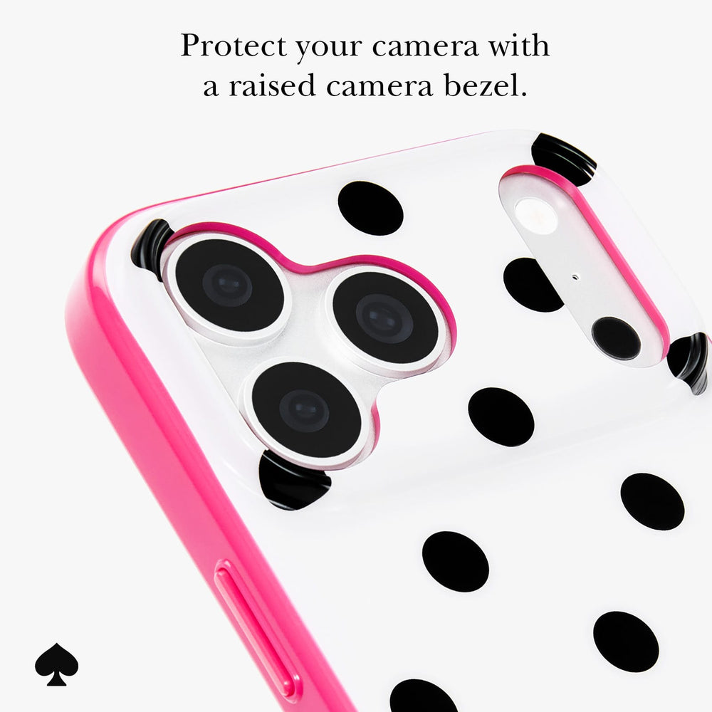 A close-up of a phone case with a bright pink raised border and a white back covered in black polka dots. The image includes text at the top reading 'Protect your camera with a raised bezel.
#color_picture dot pop pink