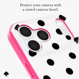A close-up of a phone case with a bright pink raised border and a white back covered in black polka dots. The image includes text at the top reading 'Protect your camera with a raised bezel.
#color_picture dot pop pink