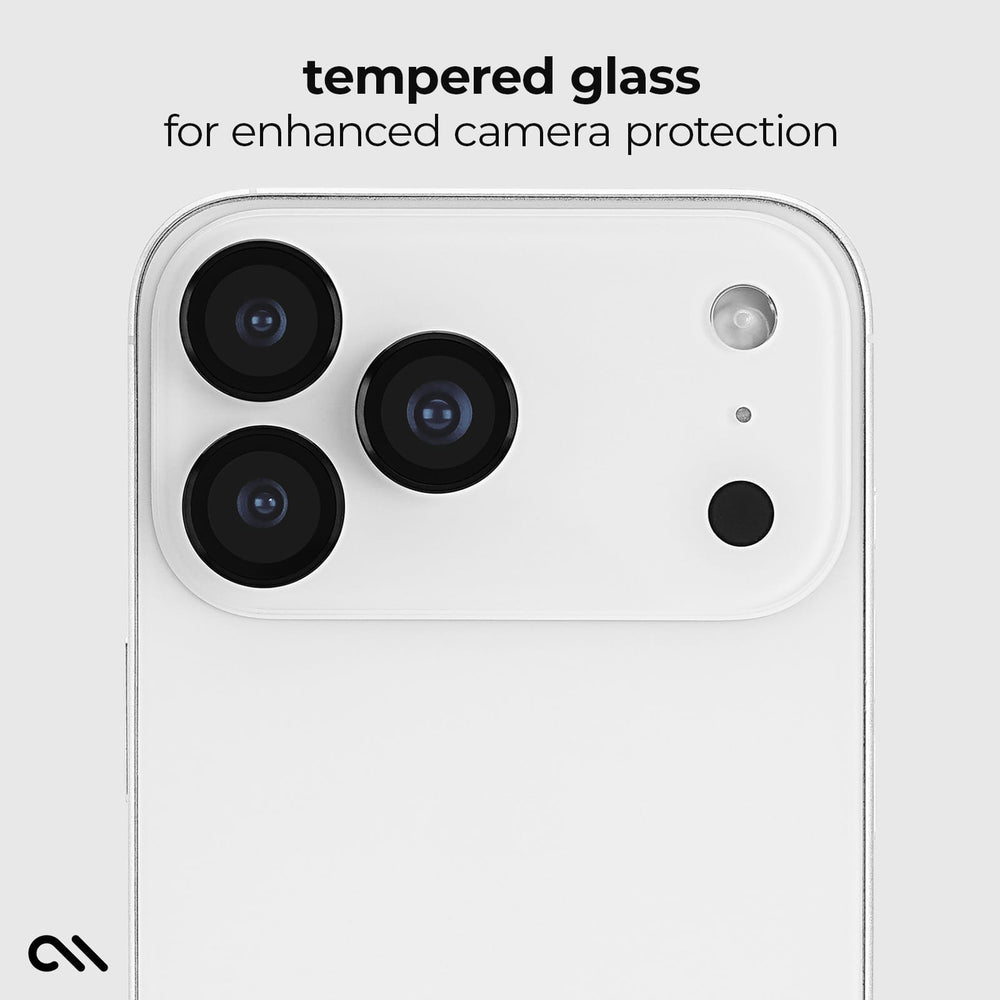 A close-up of a white smartphone showing the back camera area with three large lenses and a small flash cutout. Above the phone, text reads 'tempered glass for enhanced camera protection.
#color_midnight black