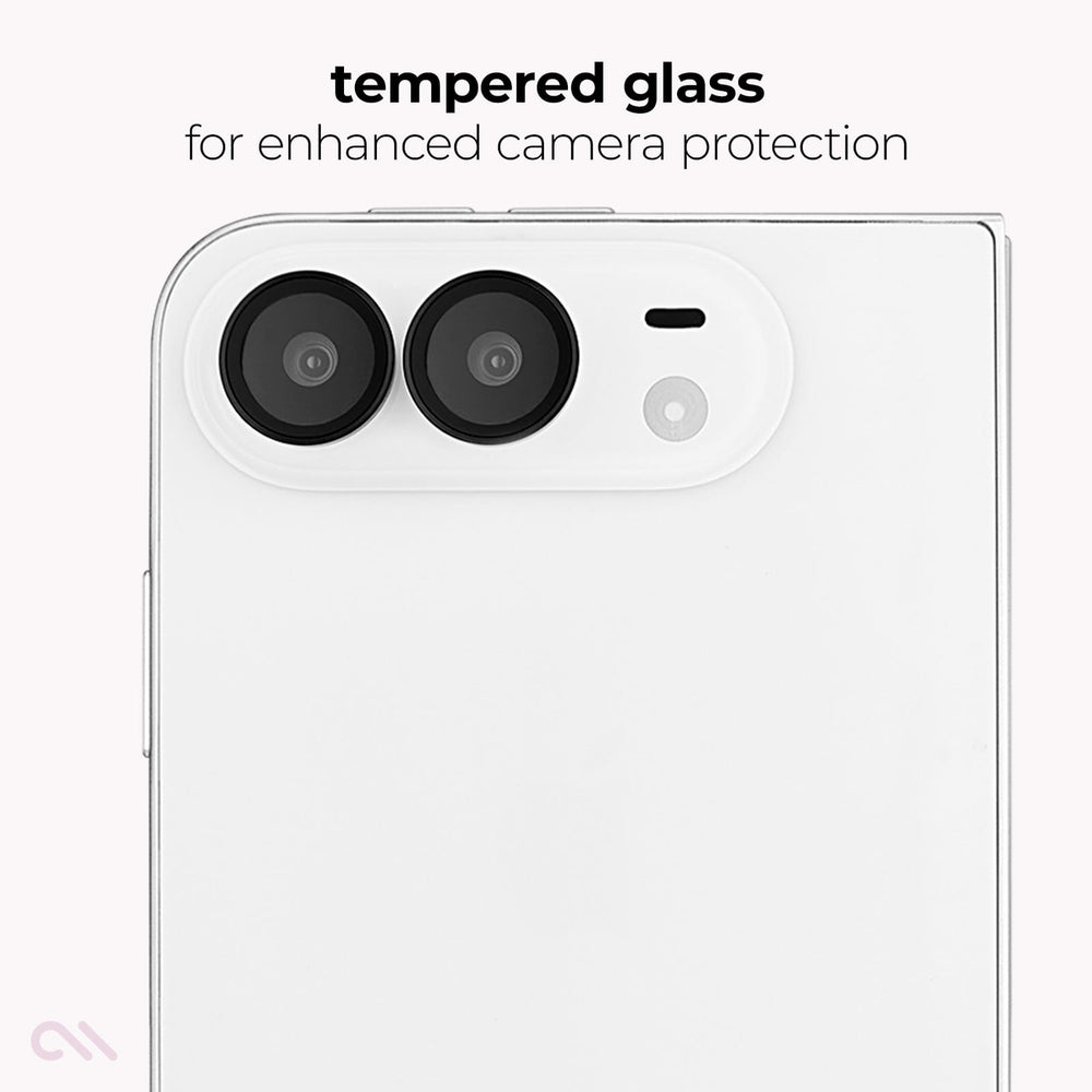 A close-up of a white smartphone showing the back camera area with two large lenses and a small flash cutout, under the text 'tempered glass for enhanced camera protection'.