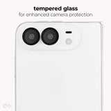 A close-up of a white smartphone showing the back camera area with two large lenses and a small flash cutout, under the text 'tempered glass for enhanced camera protection'.