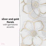 A clear phone case featuring large silver glitter and gold floral designs with small gemstone-like accents, shown next to descriptive text reading 'silver and gold florals with gemstone accents'.
#color_floral gems
