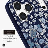 Kate Spade New York phone case featuring a blue and white floral print, shown on a smartphone with a dark blue bumper edge. The text 'kate spade NEW YORK Playful Flowerbed Blue print.
#color_flowerbed navy
