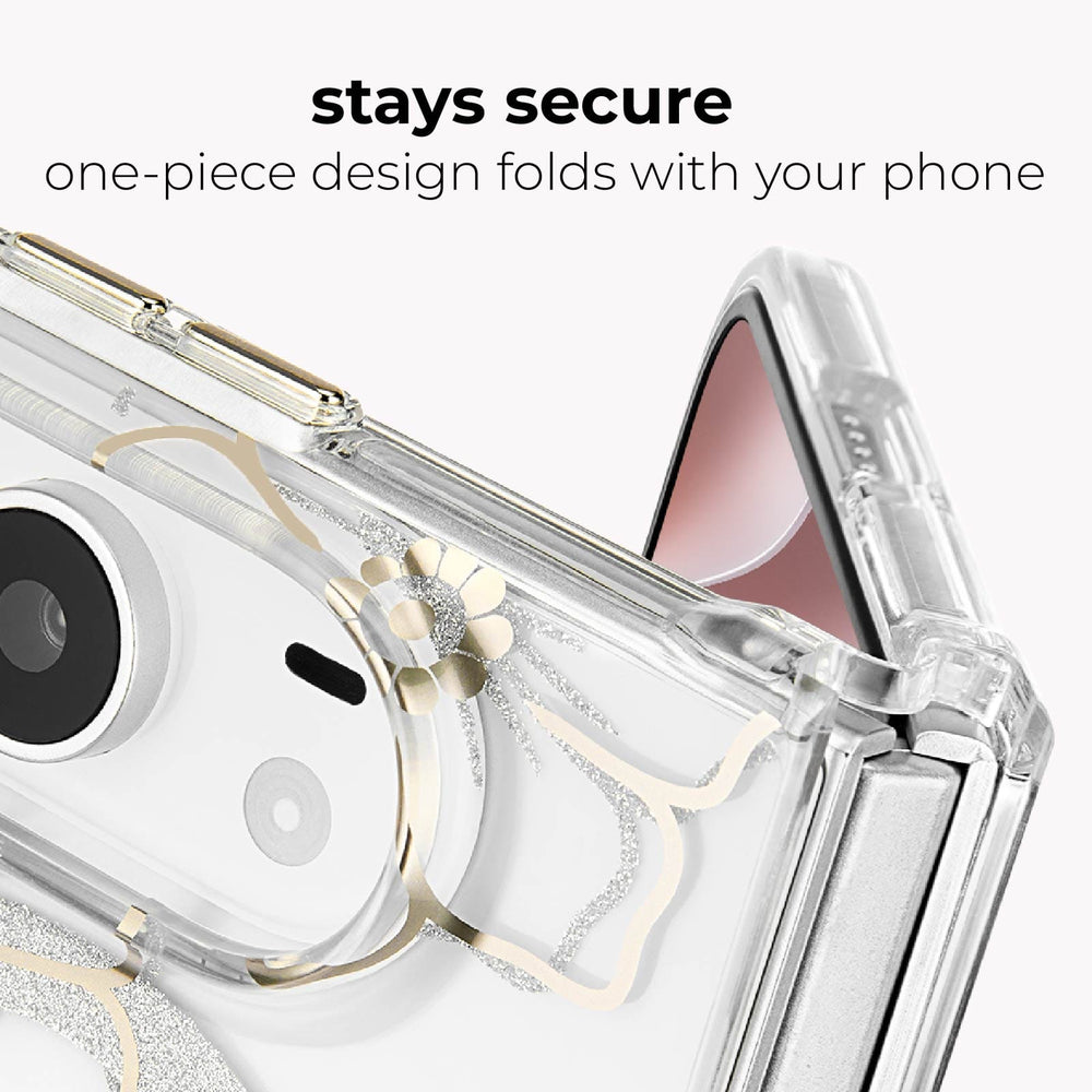 A close-up of a transparent phone case with gold glitter floral accents and a flower detail, shown fitted around a folded smartphone. Text at the top reads 'stays secure one-piece design folds with your phone' on a light gray background.
#color_floral gems