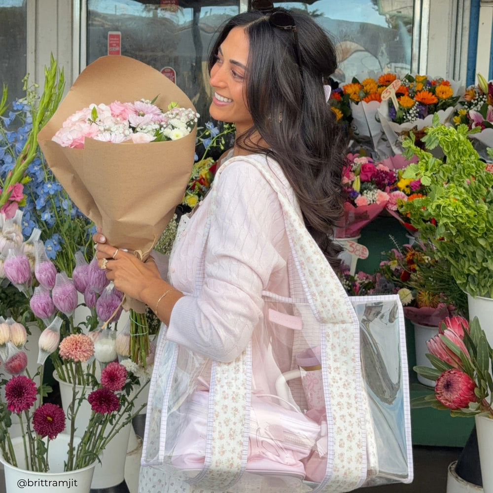 Woman holding a bouquet of flowers in a flower shop
#color_clear quilted ditsy floral 