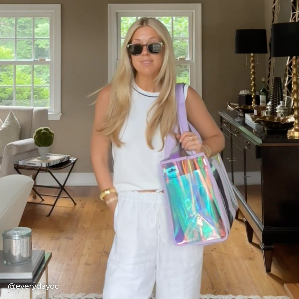 Woman in a living room holding a Soap Bubble Jelly Tote

#color_soap bubble®