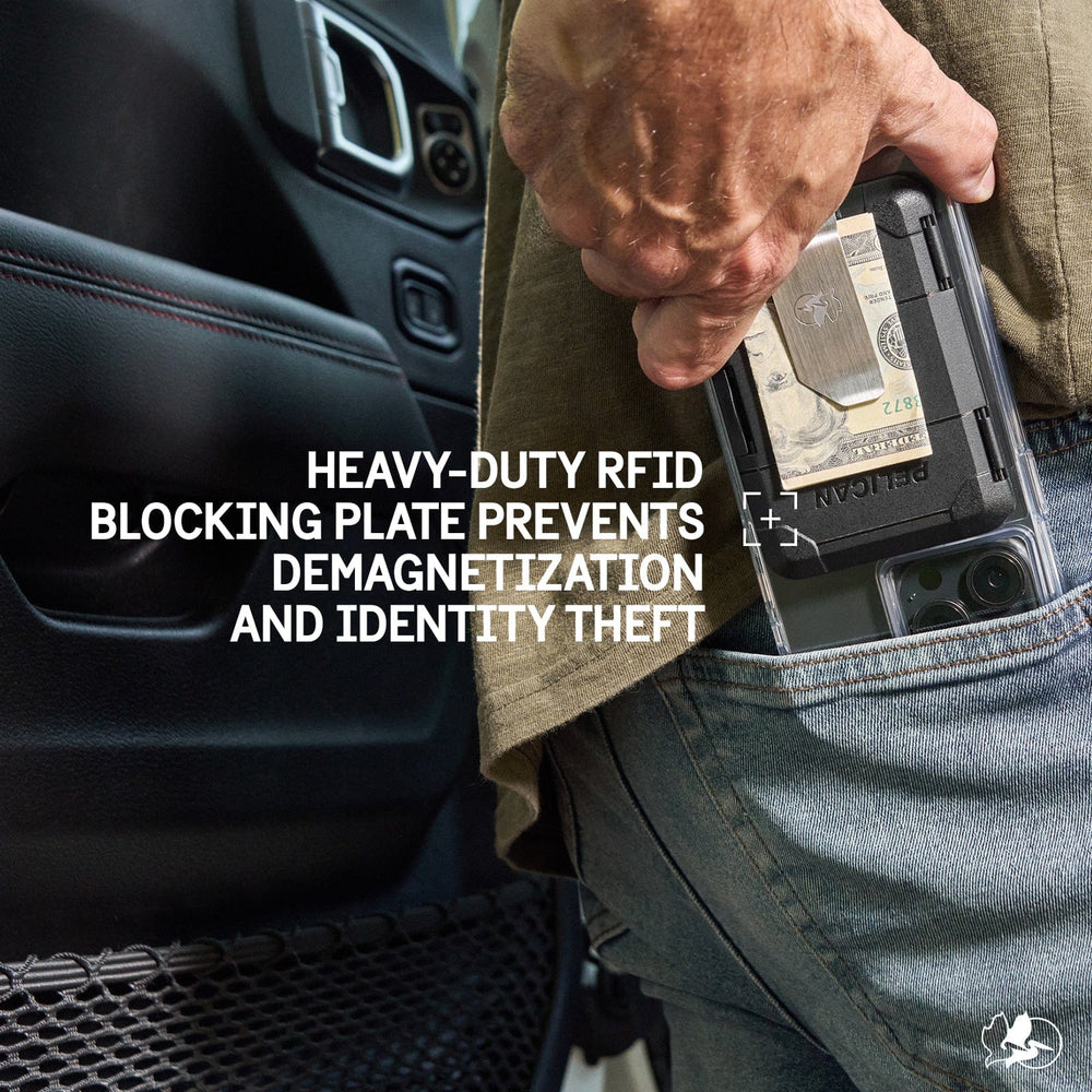 Black money clip wallet with cash and cards held in hand next to car interior.