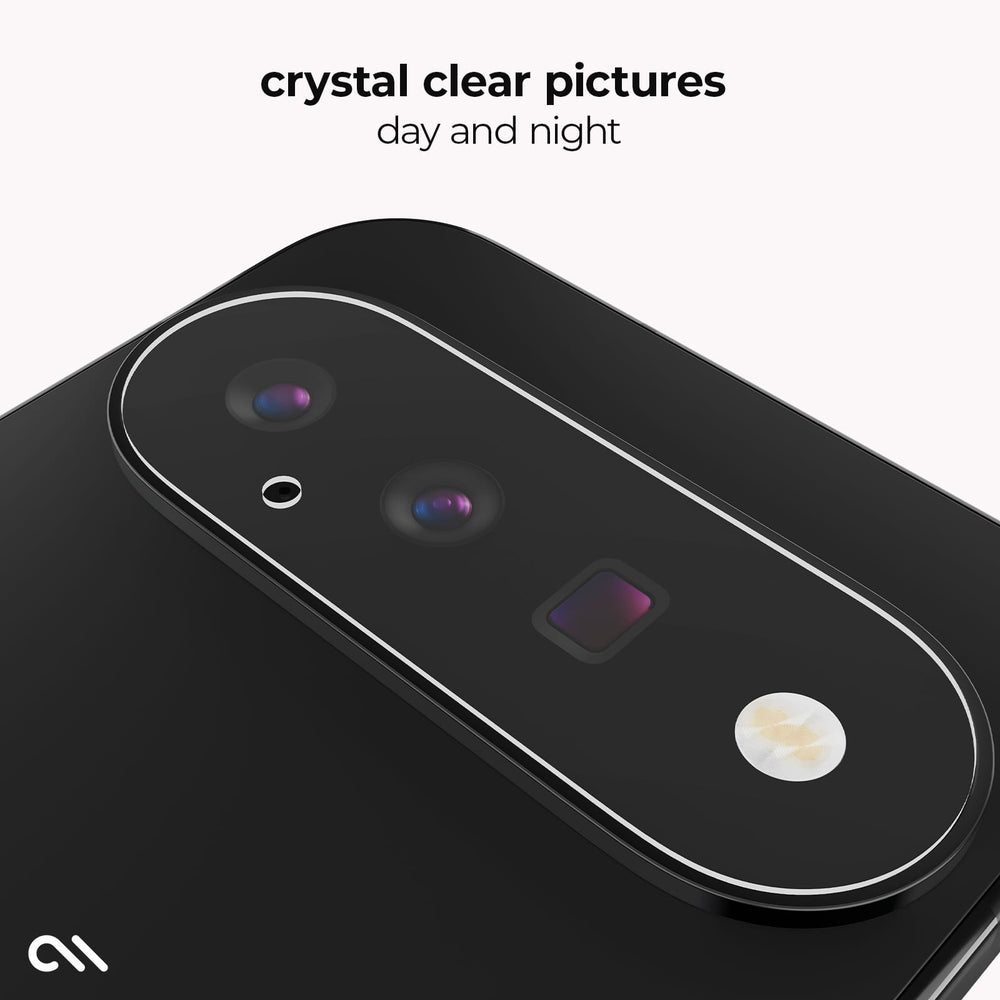 A close-up of a black smartphone showing the rear camera area with a clear, rounded camera surround and the text 'crystal clear pictures day and night' above it.