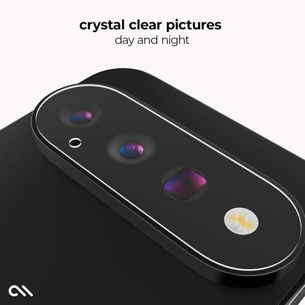 A close-up of a black smartphone showing the rear camera area with a clear protective overlay around the lenses. Text at the top reads 'crystal clear pictures day and night' on a light gray background.