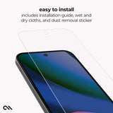 A clear tempered glass screen protector is shown floating above a smartphone, with text at the top reading 'easy to install' and 'includes installation guide, wet and dry cloths, and dust removal sticker.' The phone screen displays a blue and green wallpaper.