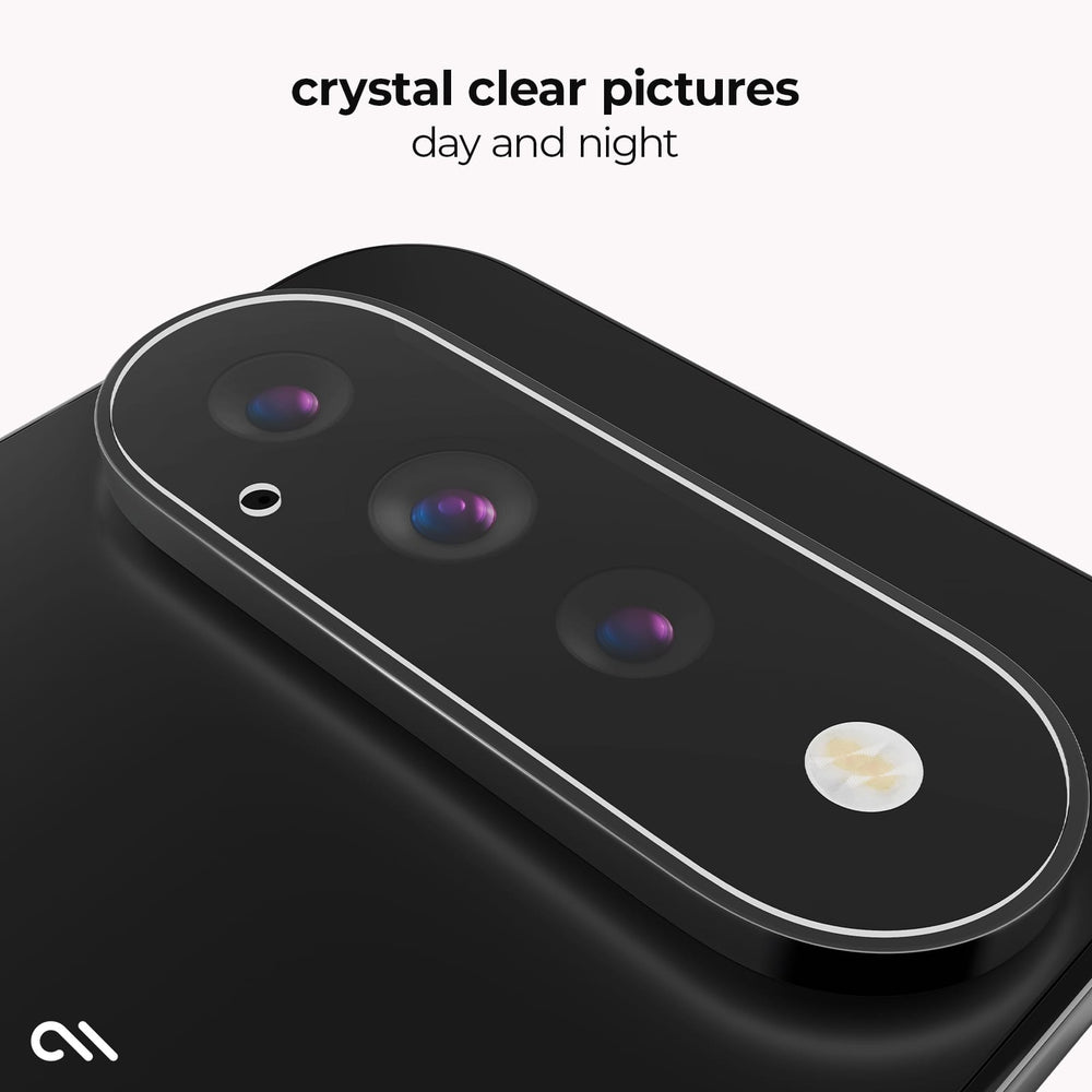 A close-up of a black smartphone camera module with three lenses and a flash, shown on a light gray background with the text 'crystal clear pictures day and night' and a small white logo in the lower left.