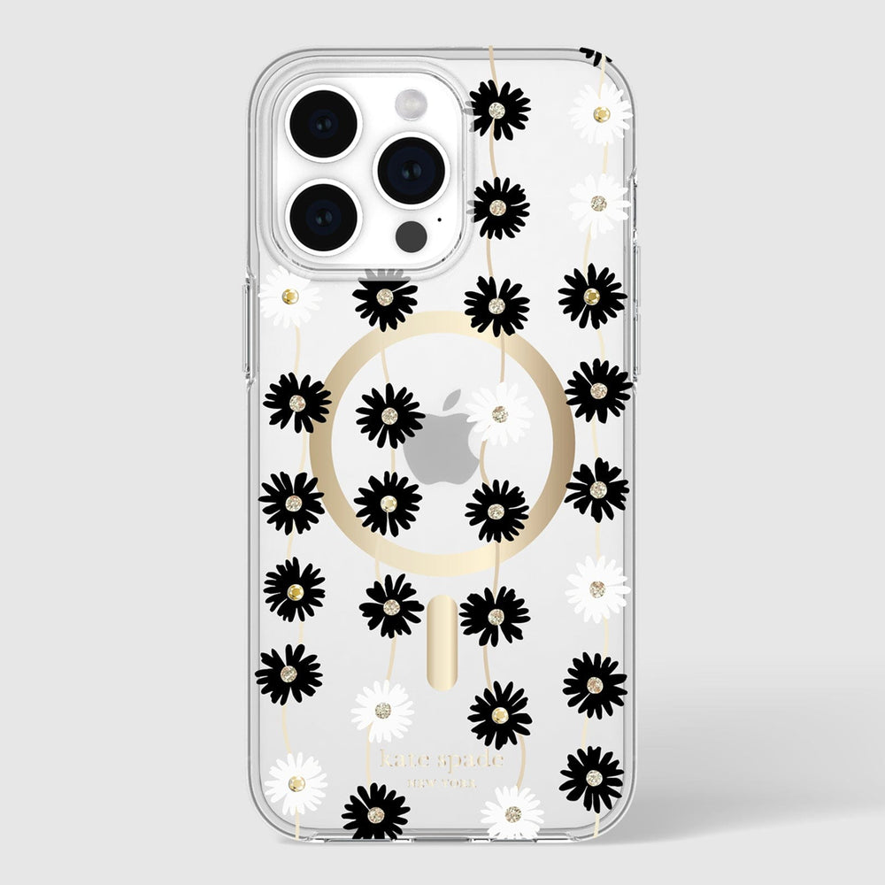 Clear iPhone 15 Pro Max case with black and white daisy pattern, gold MagSafe ring, and small rhinestone accents throughout.