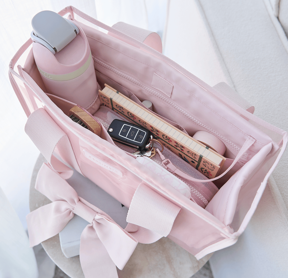 The jelly tote folded flat inside a suitcase