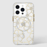 Clear iPhone 15 Pro case with gold and silver floral outline designs and pearl-embellished flower centers.