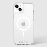 Clear protective iPhone case with dual camera cutout and circular MagSafe ring attachment on white phone.