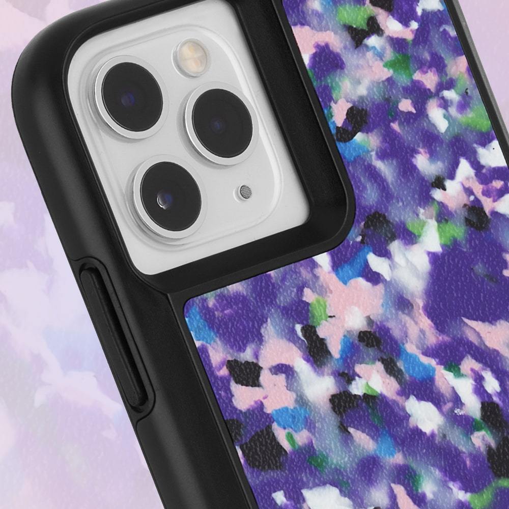 Up close of corner of multicolored recycled iPhone 11 Pro Max case. color::Purple Rain