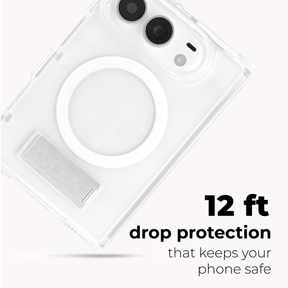 Clear protective phone case with a circular MagSafe ring and a fold-out stand, shown on a light gray background with text reading '12 ft drop protection that keeps your phone safe' and a visible CASEMATE logo on the stand.
#color_tough plus clear