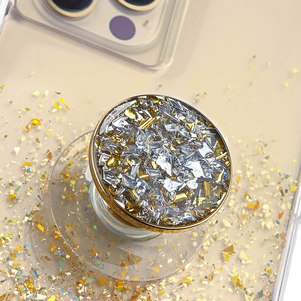 Close up of gold sparkly phone grip suction cupped to case. color::Twinkle Gold