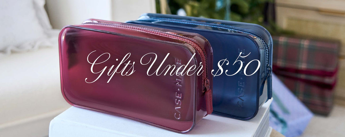 Gifts under $50 text over image of jelly makeup bags on a table surface