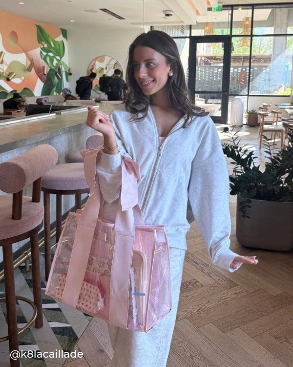 Girl in cafe in grey sweatsuit with Ballet Pink Bow Jelly Tote Bag