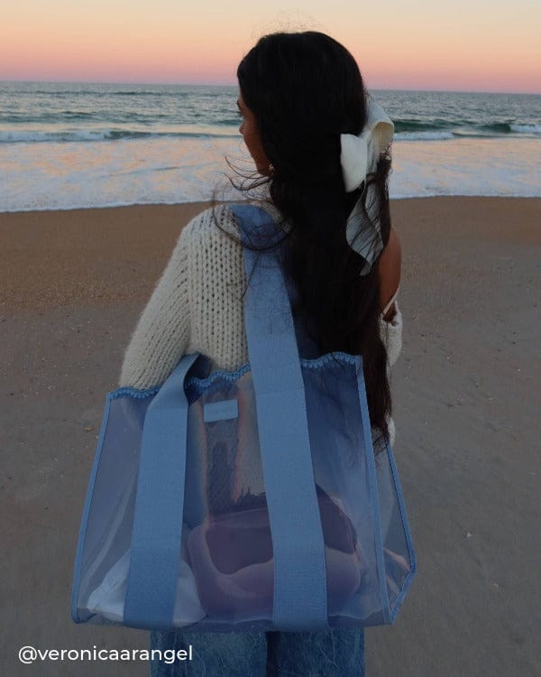 Girl by the ocean at sunset with Crochet Wave Jelly Tote