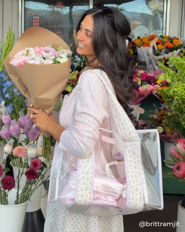 Woman by flower stand holding a bouquet of flowers and Quilted Ditsy Floral Jelly Tote
