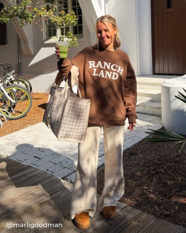 Girl standing outside on a stoop with a brown sweatshirt and a matcha latte and Latte Gingham Jelly Tote bag