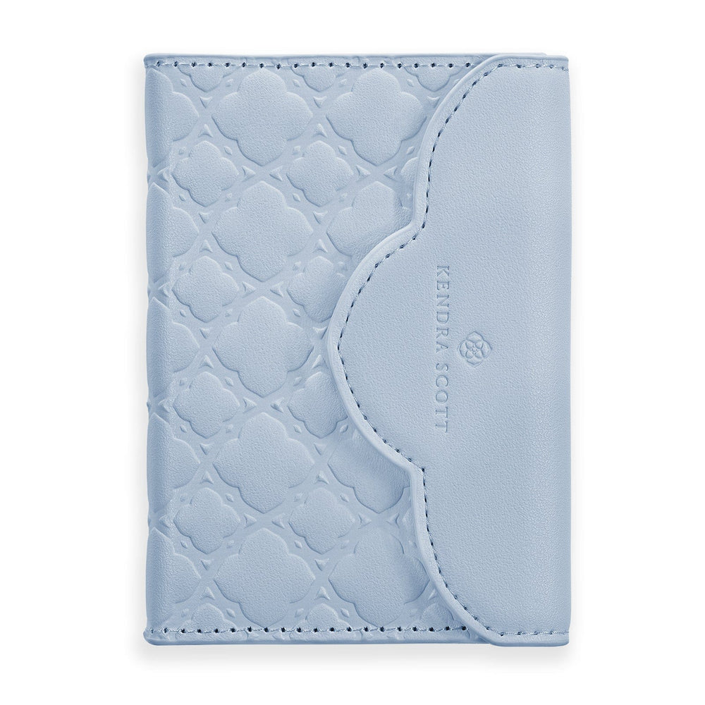 Light blue textured cardholder with 'Kendra Scott' branding on a white background #color_blue filigree