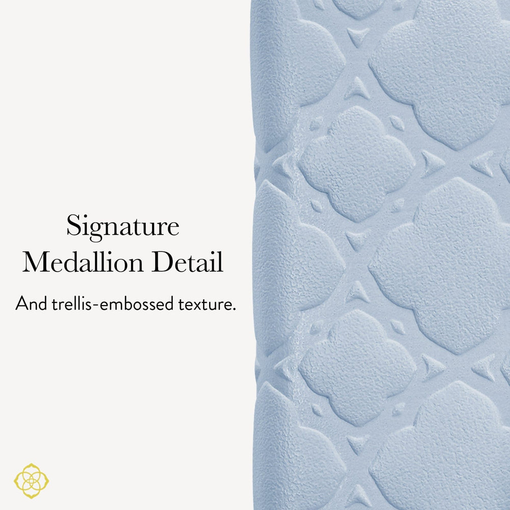 Textured wallet with signature medallion detail and trellis-embossed texture on a white background #color_blue filigree