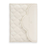 White quilted leather cardholder with brand logo on a white background 

#color_Ivory Filigree