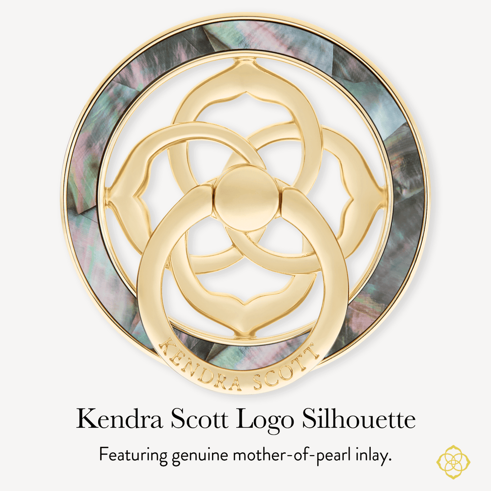 A circular Kendra Scott logo silhouette plaque or emblem with polished gold-tone metal and iridescent mother-of-pearl inlay, shown on a light gray background with the text 'Kendra Scott Logo Silhouette' and 'Featuring genuine mother-of-pearl inlay.'.

#color_black mother of pearl