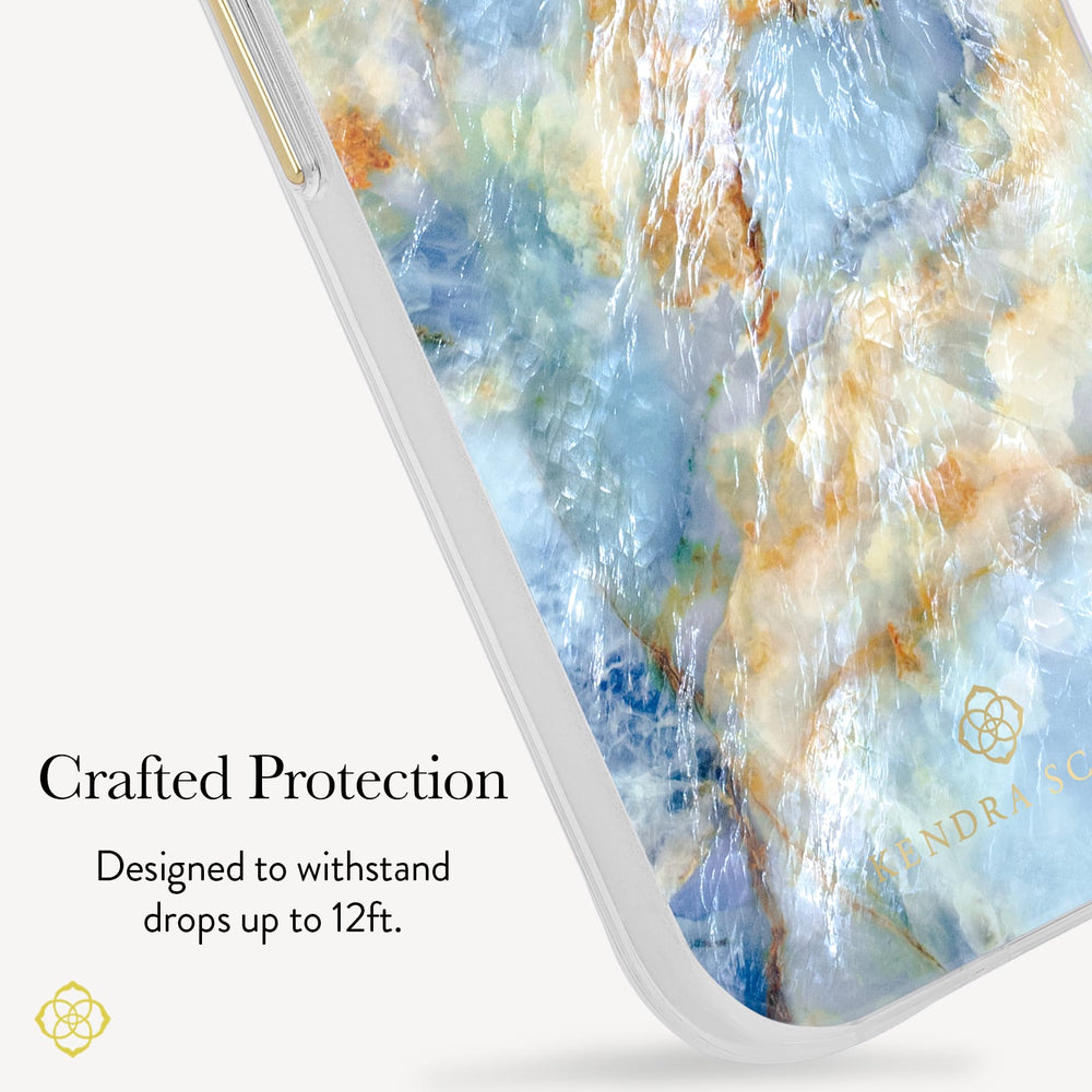 A close-up of a smartphone case with a marbled blue, white, and gold pattern, shown on a phone edge against a light background with text reading 'Crafted Protection' and 'Designed to withstand drops up to 12ft.'.