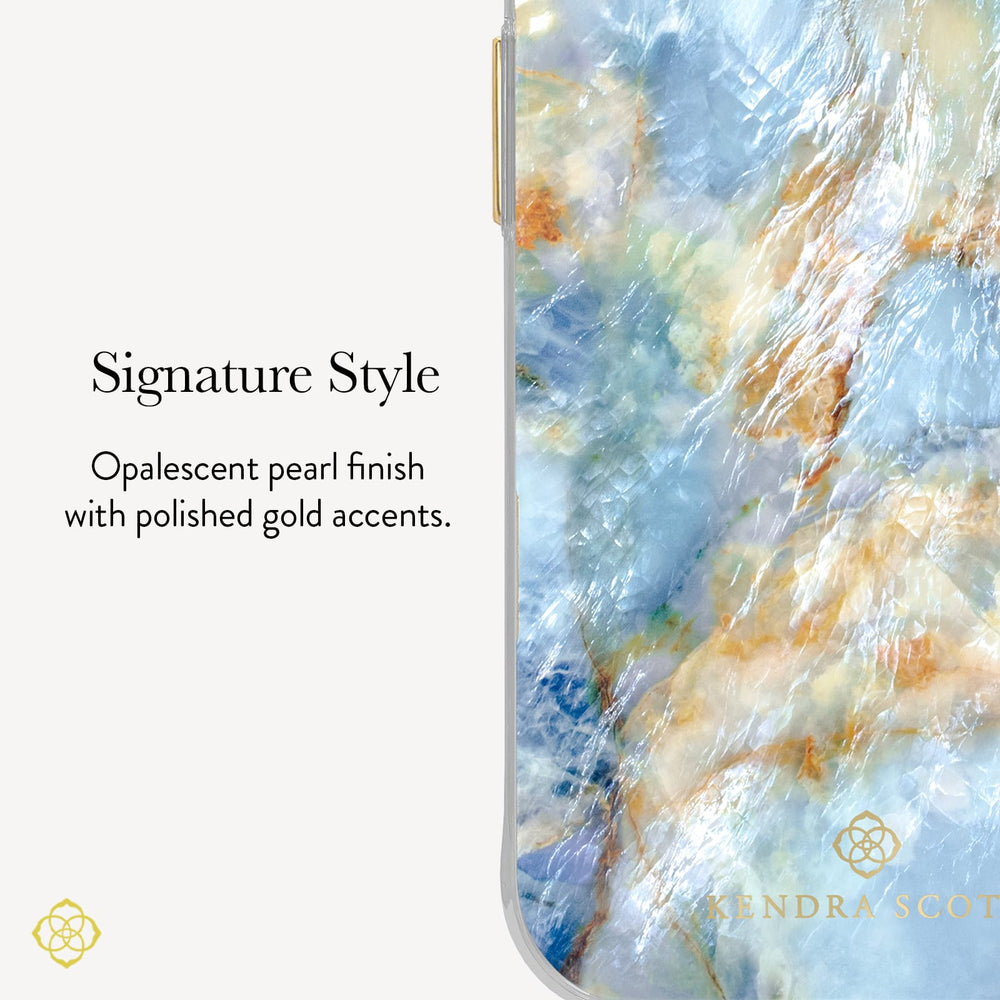A close-up of a phone case with a marbled opalescent finish in shades of light blue, white, and soft gold, shown next to text reading 'Signature Style' and 'Opalescent pearl finish with polished gold accents.' A small 'KENDRA SCOTT' logo appears near the bottom right of the case.
