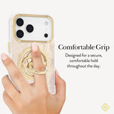 Phone case with a gold ring holder being held by a hand, on a white background. #color_gold