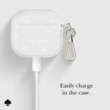 Kate Spade wireless earbuds case with keychain on a light gray background