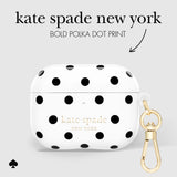 White AirPods case with bold black polka dots and gold 'kate spade new york' lettering, shown with a gold clasp on a light gray background with product text above.