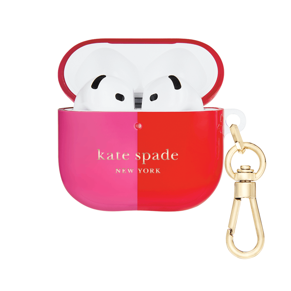 Kate Spade New York AirPods case in a glossy red and pink gradient, shown open with white AirPods inside and a gold-tone keychain attached on a white background.