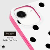 A close-up of a phone case with a white back decorated with black polka dots, a bright pink bumper edge, and a matching pink camera surround. The brand name 'kate spade NEW YORK' is displayed on the left, along with the text 'Playful Polka Dot Print' and a black spade icon.