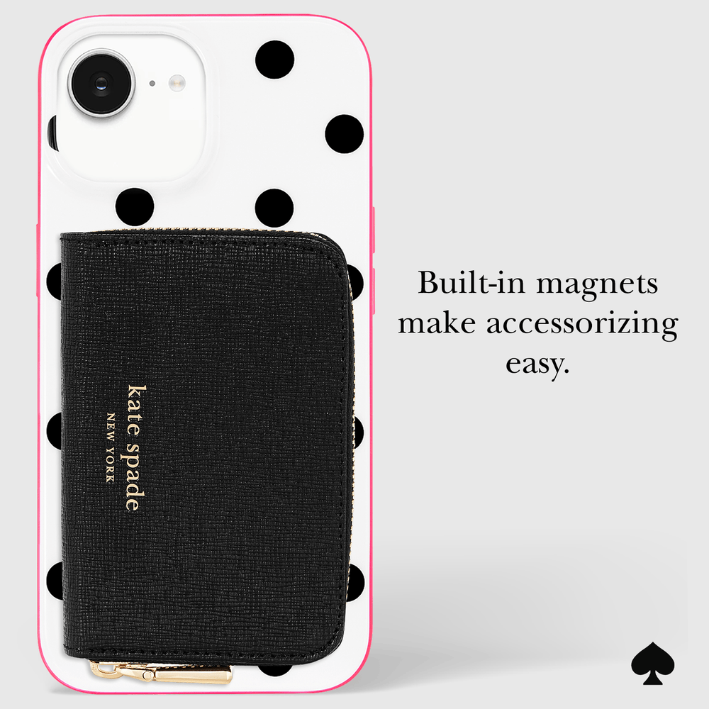 Kate Spade New York black textured wallet with gold logo, shown attached to a white phone case with black polka dots and a pink border. Text on the right reads 'Built-in magnets make accessorizing easy.