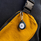 Pelican Protector AirTag case attached to pouch. color::Navy