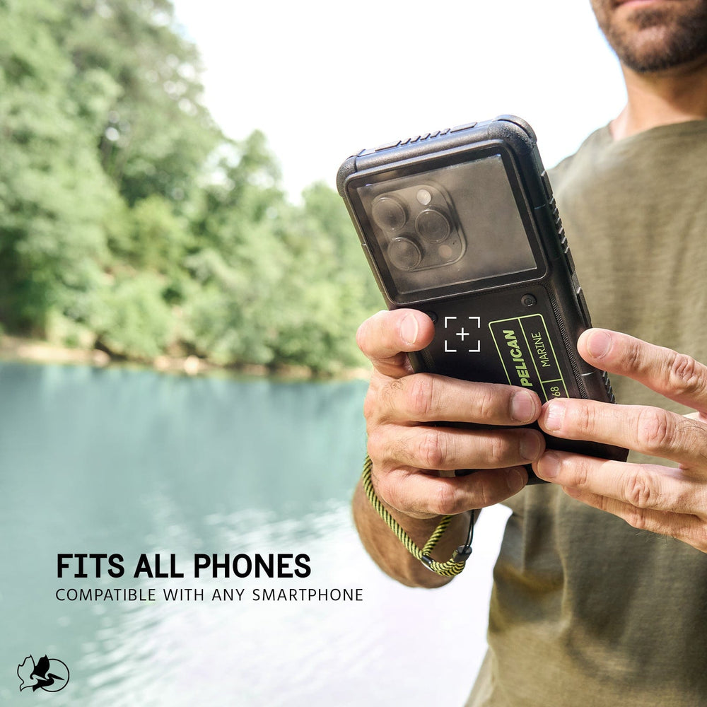 Black waterproof case with rugged bumpers held in hands near water, featuring camera window and control buttons.