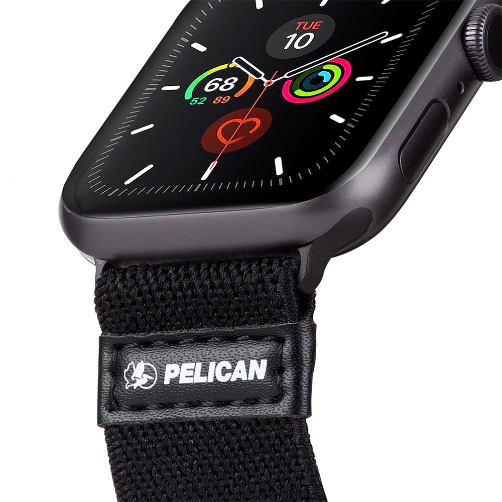 Apple Watch with gray protective case and black fabric band with Pelican logo and leather accent.