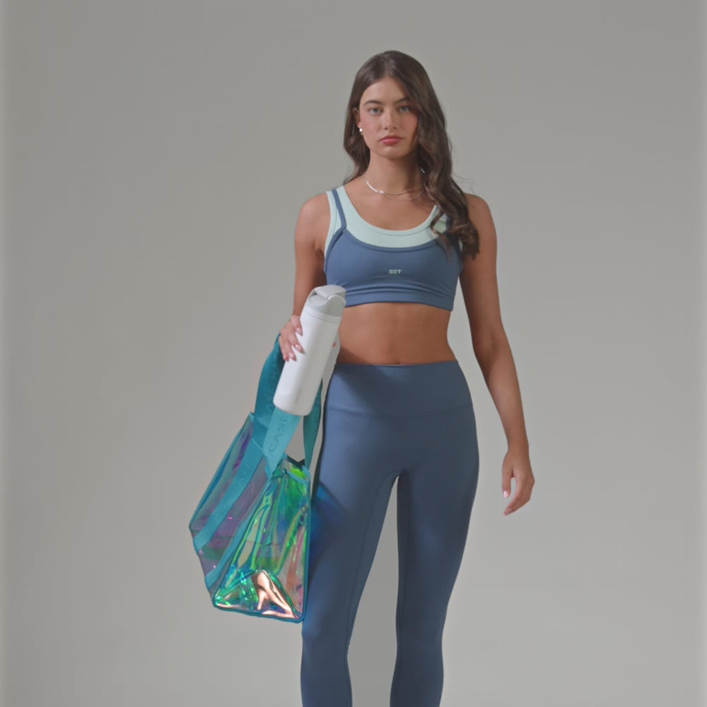 A emarld soap bubble tote bag showing how big it is by a water bottle
#color_emerald blue iridescent