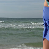 A woman showing her waterproof floating pouch #color_citrus splash