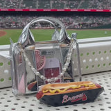 Girl at a baseball game packing up her essentials in her Stadium Bag 

#color_silver chrome
